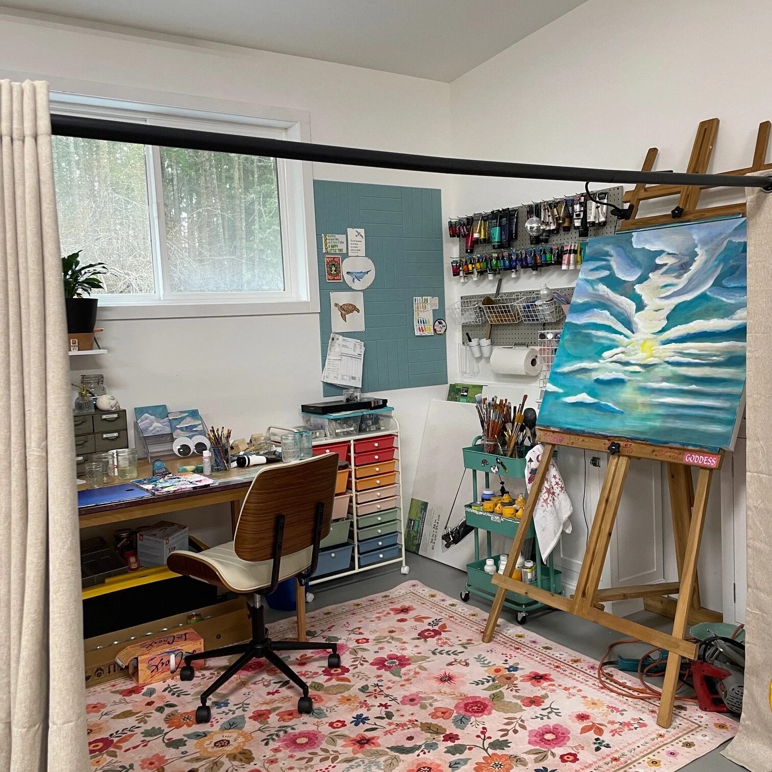 A private studio with a painting, an easel and a rug