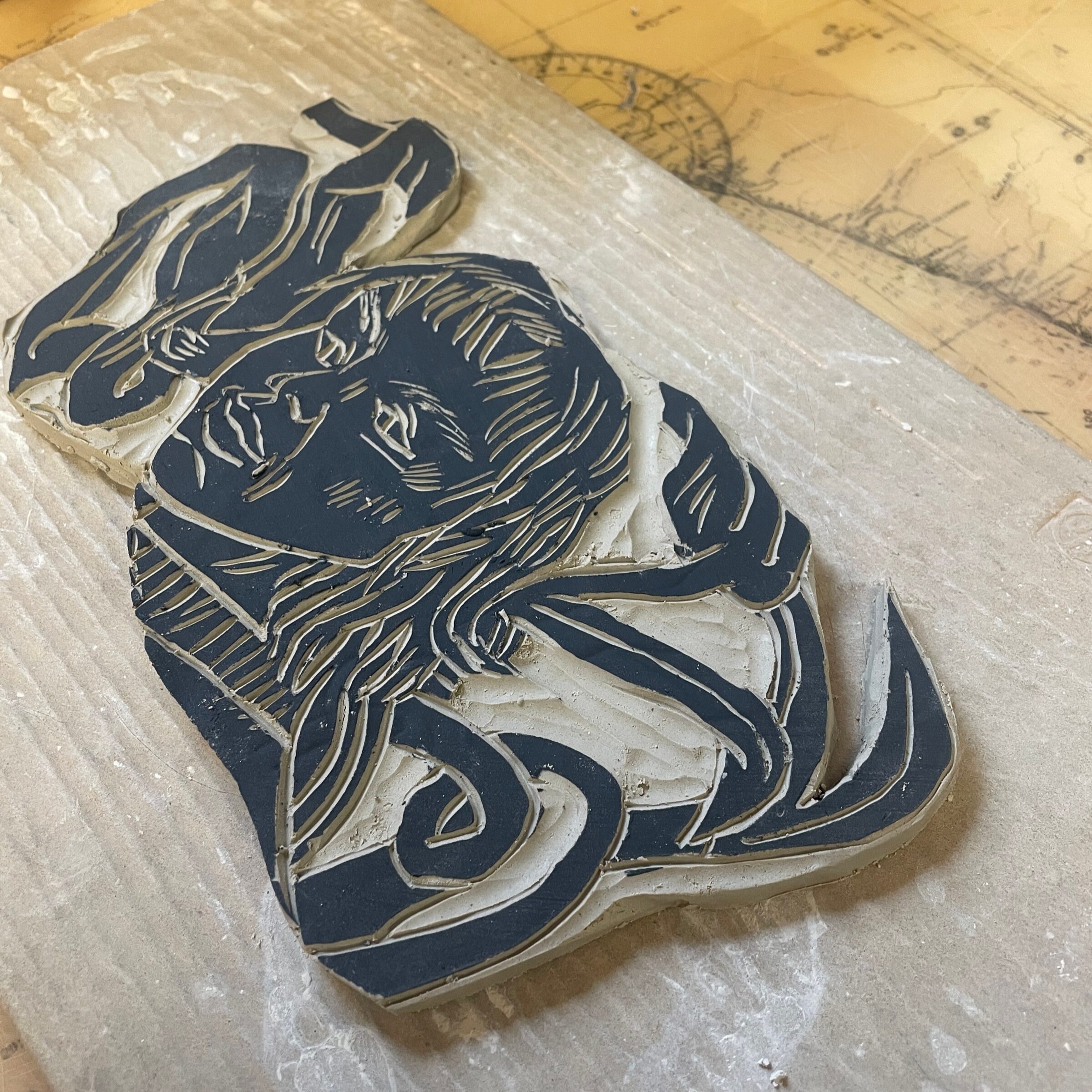 A sgraffito tile with a carved figure