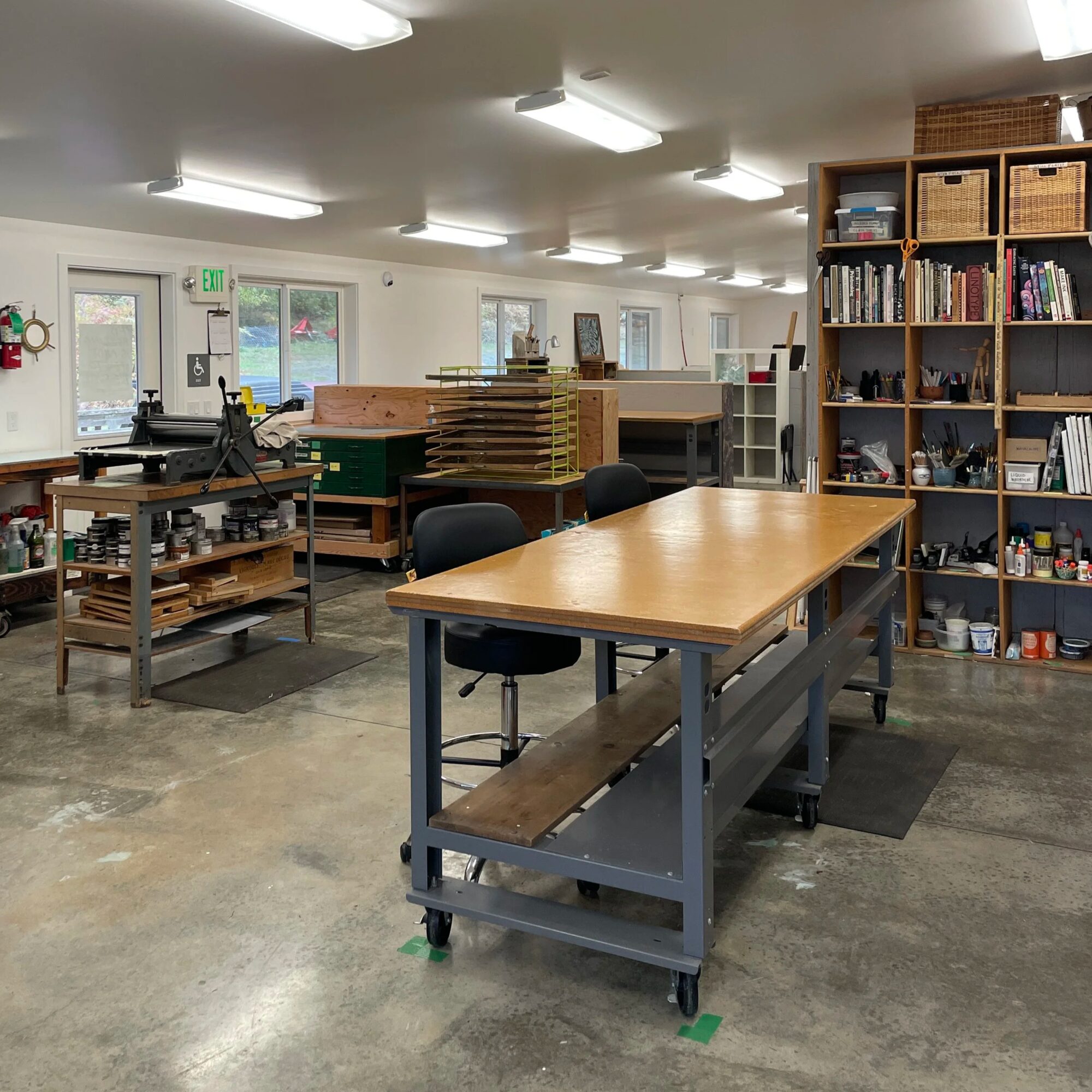 The Big Studio, with long work tables and the yarn library