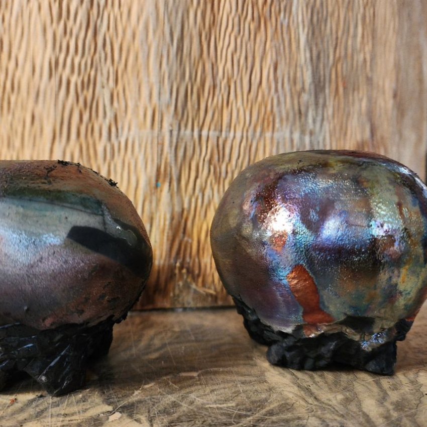 Two raku-fired pots with a metallic glaze